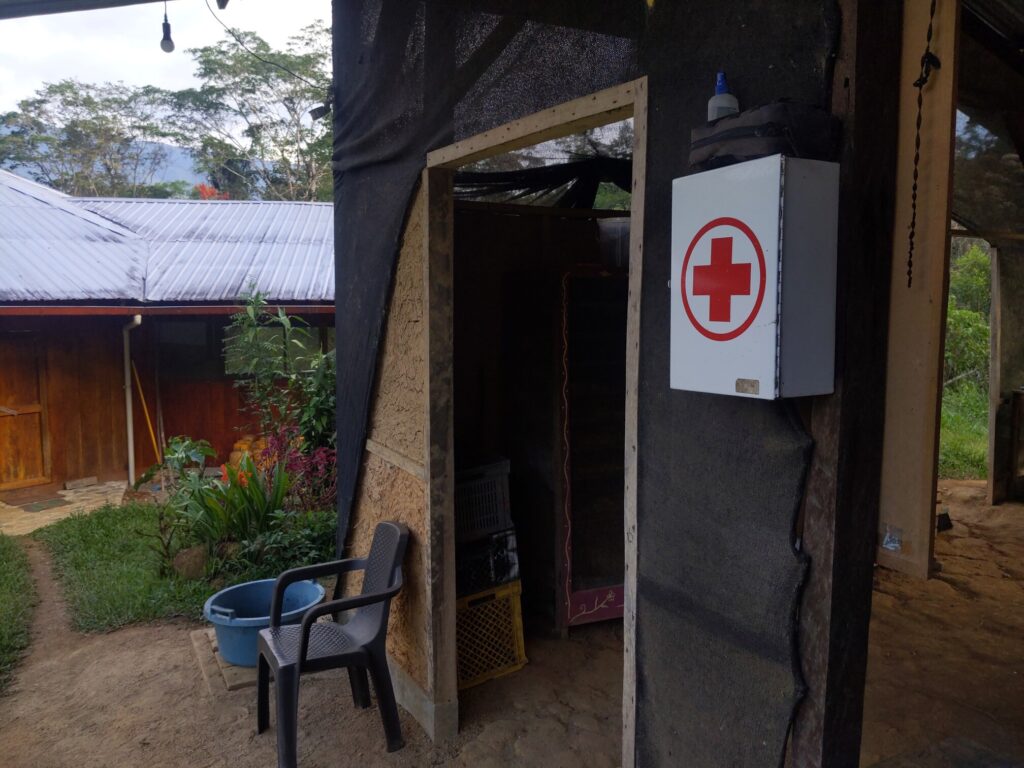Photo of a cabinet branded with a red cross mounted to a wall